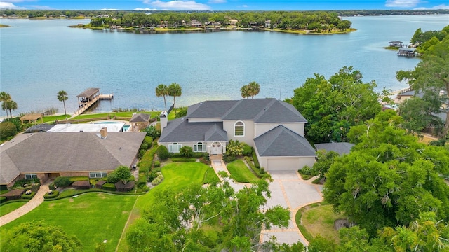 birds eye view of property with a water view