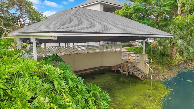 exterior space with a water view and a gazebo