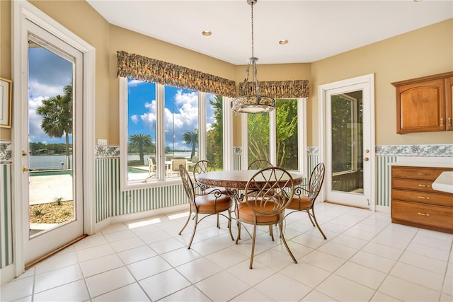 dining space featuring light tile patterned floors