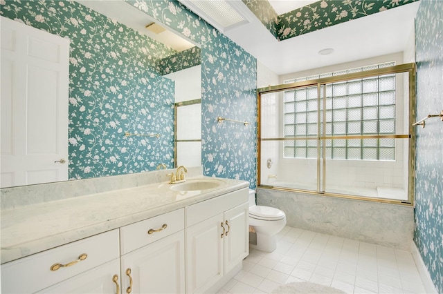 full bath featuring enclosed tub / shower combo, toilet, vanity, tile patterned floors, and wallpapered walls