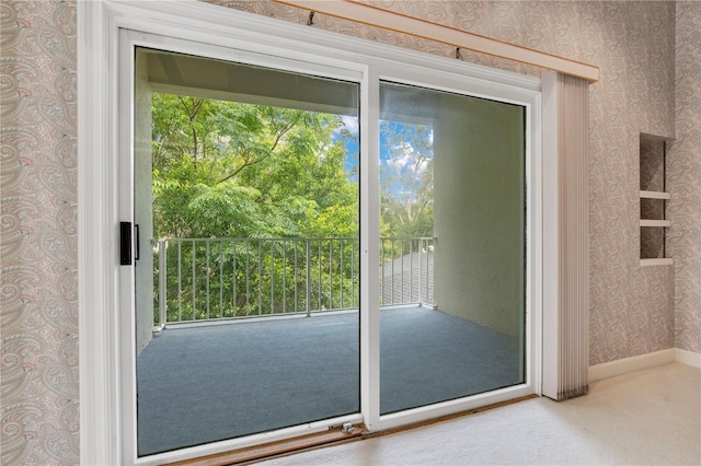 entryway featuring wallpapered walls and baseboards