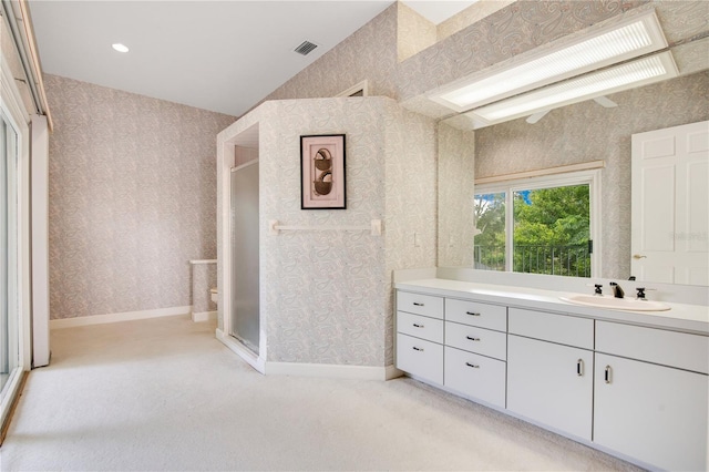 full bath with baseboards, vaulted ceiling, visible vents, and wallpapered walls