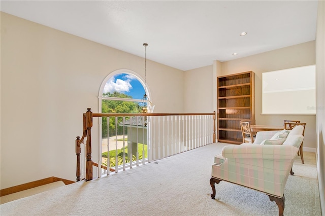 sitting room featuring recessed lighting, light carpet, and baseboards