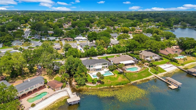 bird's eye view featuring a water view, a residential view, and a view of trees