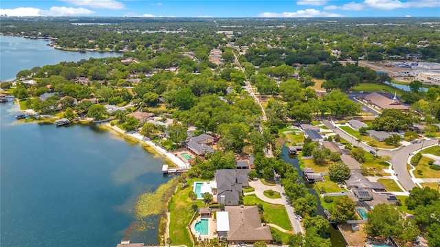 birds eye view of property with a residential view and a water view