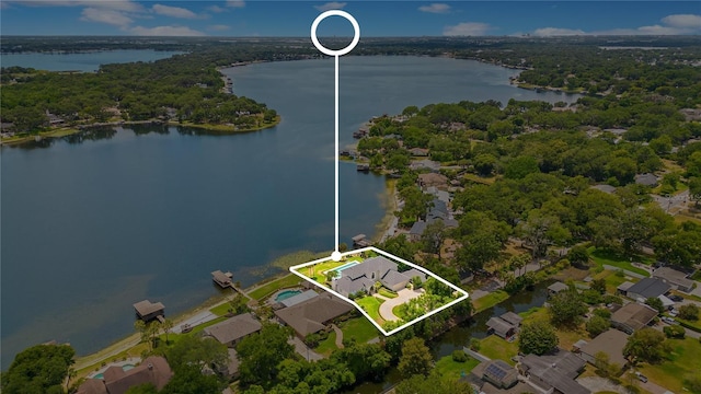 birds eye view of property with a water view