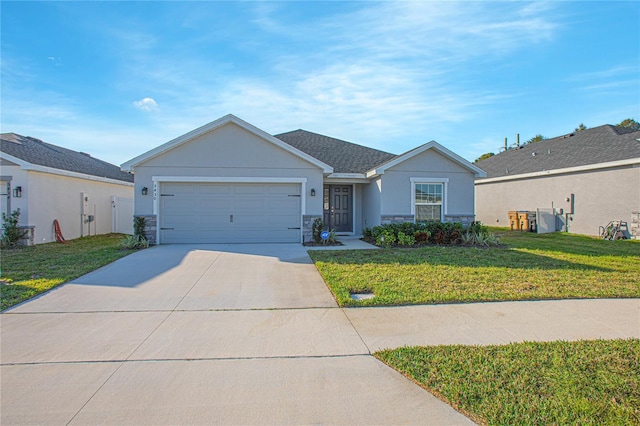 single story home featuring a garage and a front yard