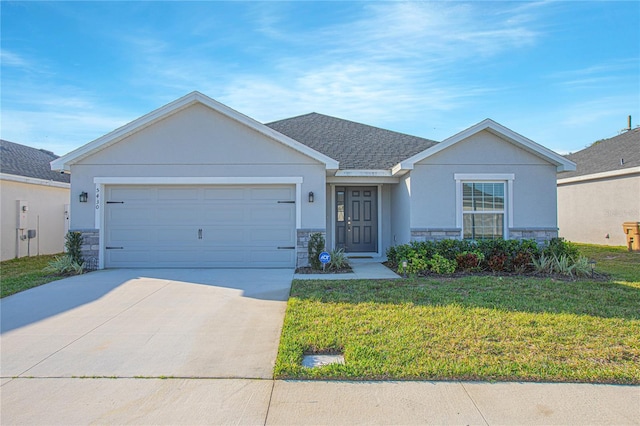 single story home featuring a garage and a front yard