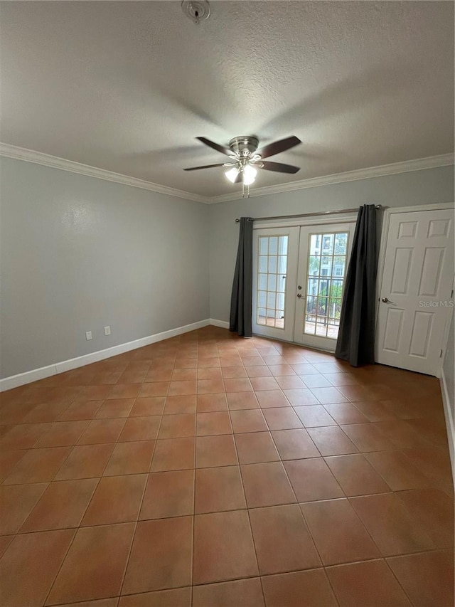 tiled spare room with ceiling fan, ornamental molding, french doors, and a textured ceiling