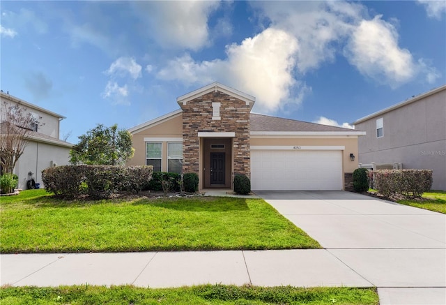 view of front of house with a front yard and a garage