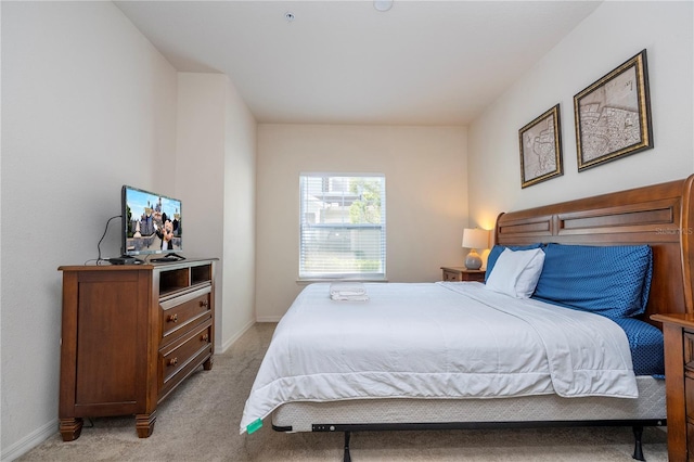 bedroom with light carpet