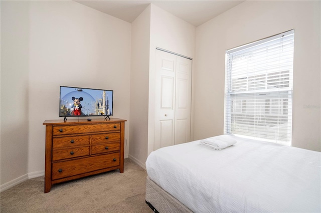 carpeted bedroom featuring a closet