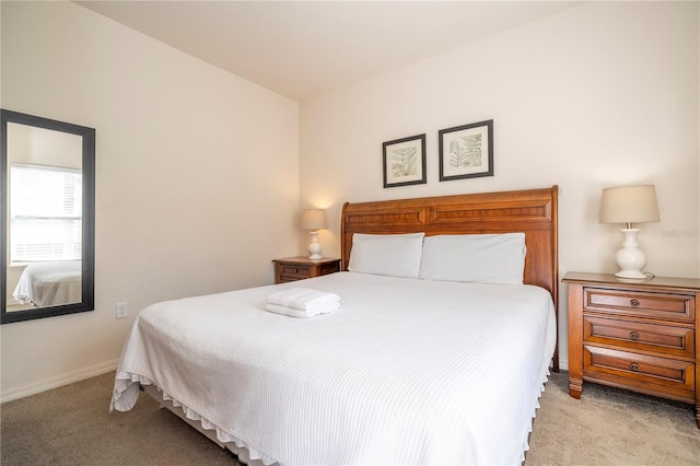 bedroom with light colored carpet