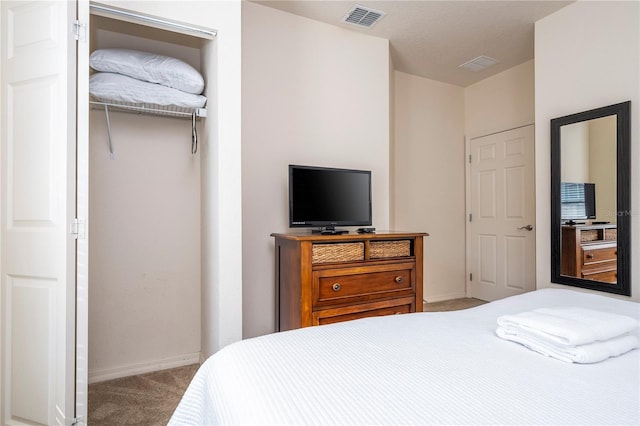 carpeted bedroom with a closet