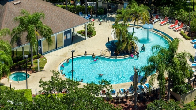 view of swimming pool with a community hot tub and a patio