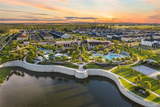 aerial view at dusk with a water view