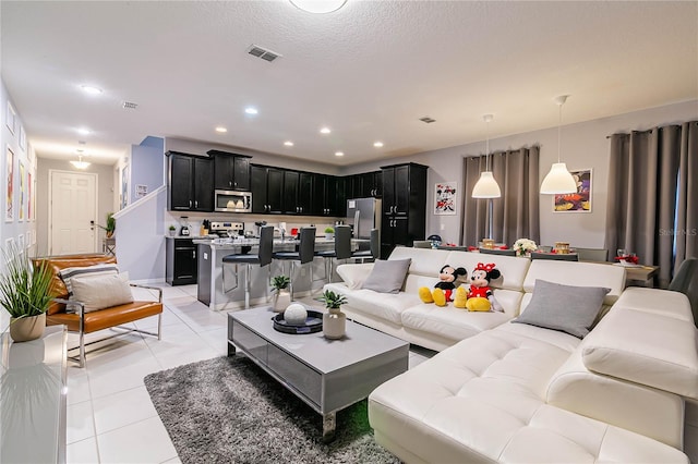 living room with light tile patterned flooring