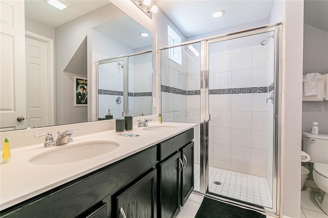 bathroom with vanity, an enclosed shower, and toilet