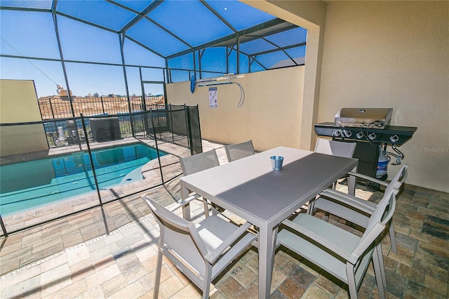 view of patio / terrace featuring grilling area, a fenced in pool, and glass enclosure