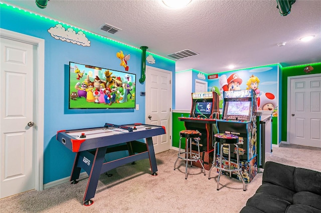 rec room featuring indoor bar, carpet flooring, and a textured ceiling