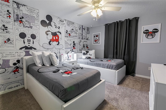 bedroom featuring ceiling fan, carpet floors, and a textured ceiling