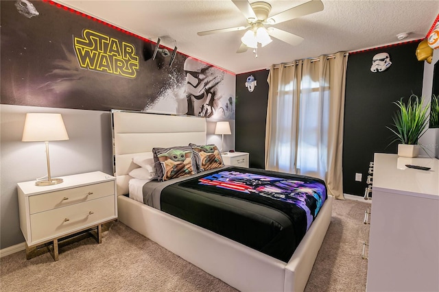 carpeted bedroom with a textured ceiling and ceiling fan