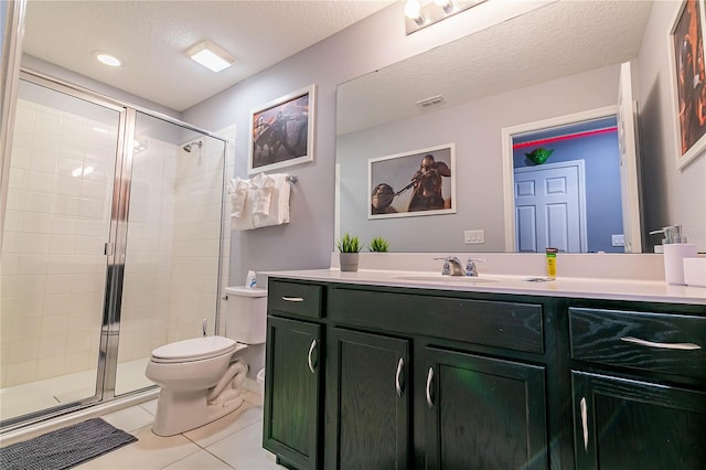 bathroom featuring a shower with door, tile patterned floors, toilet, a textured ceiling, and vanity