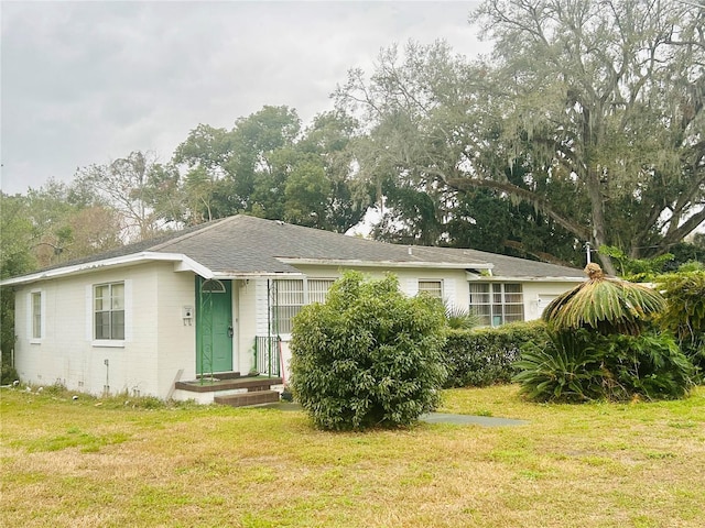 ranch-style house with a front yard