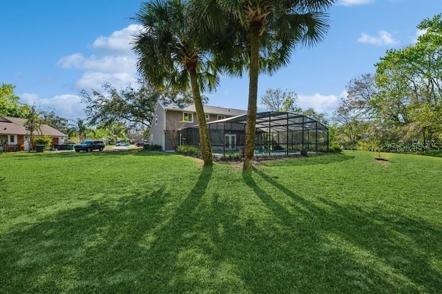 view of yard featuring glass enclosure