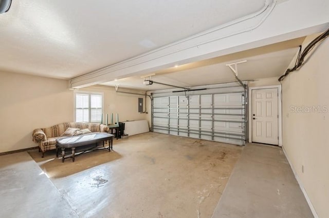 garage with a garage door opener, electric panel, and baseboards