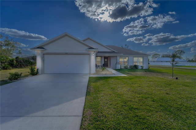 ranch-style house featuring a front yard and a garage