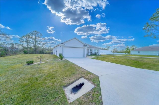 view of side of home featuring a garage and a yard