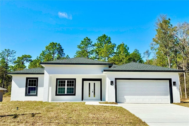 view of front facade with a front lawn and a garage