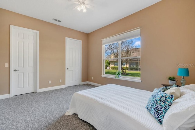 bedroom featuring visible vents, baseboards, and carpet floors