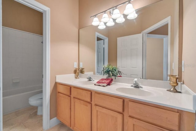 bathroom featuring a sink, washtub / shower combination, toilet, and double vanity