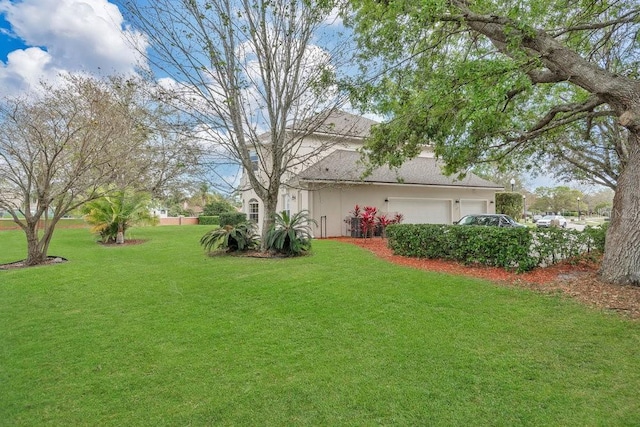 view of yard featuring a garage