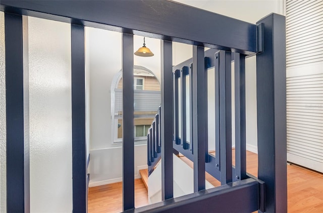 interior space with wood finished floors and baseboards