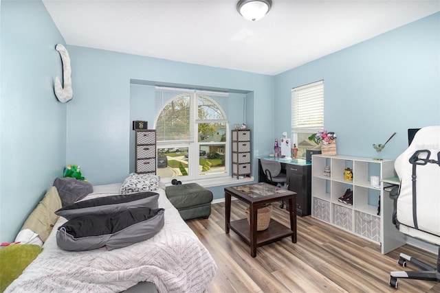 bedroom with light wood finished floors