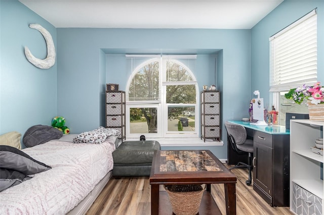 bedroom featuring light wood-style flooring