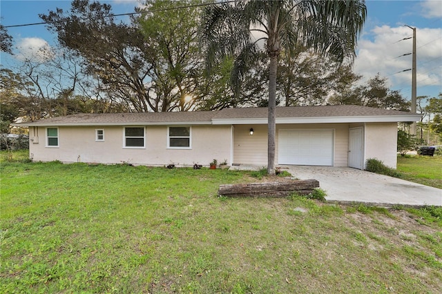 view of front of property featuring a garage and a front yard