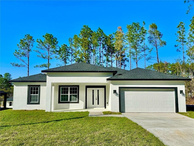 prairie-style home with a garage and a front lawn