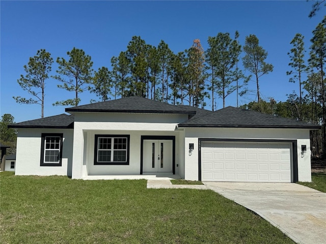 view of front facade featuring a garage, concrete driveway, a front lawn, and stucco siding