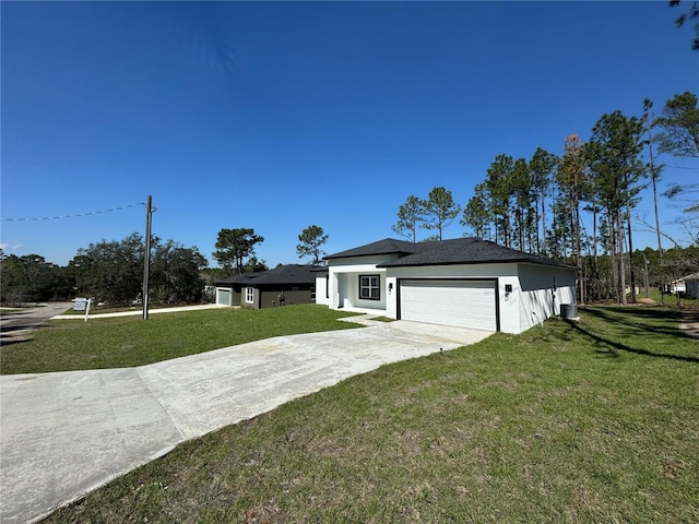 view of front of home with a garage, driveway, a front lawn, and stucco siding