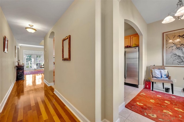 hallway with light tile patterned floors