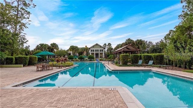 view of pool featuring a patio and a gazebo