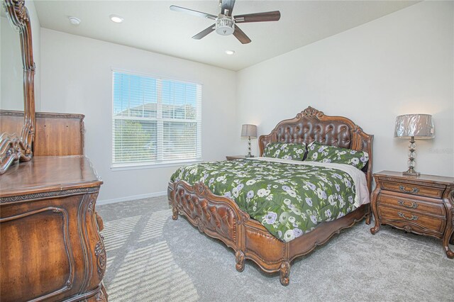 carpeted bedroom with ceiling fan, baseboards, and recessed lighting