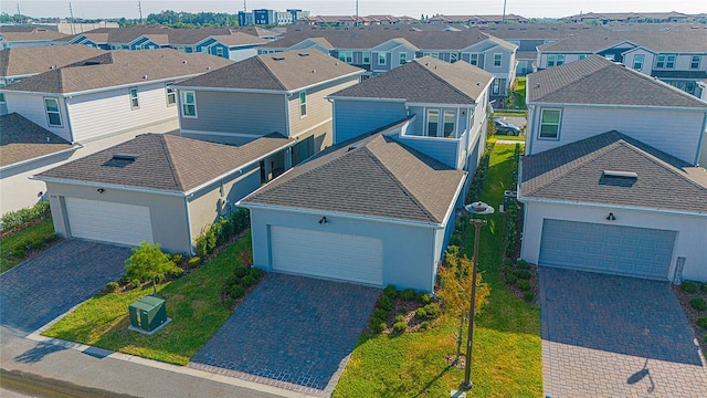 birds eye view of property with a residential view