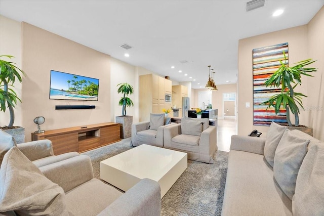 living room with visible vents and recessed lighting