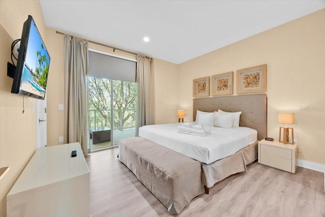 bedroom with access to outside, light wood-style flooring, baseboards, and recessed lighting