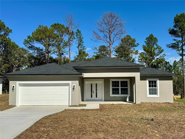 ranch-style home featuring a garage, concrete driveway, and stucco siding